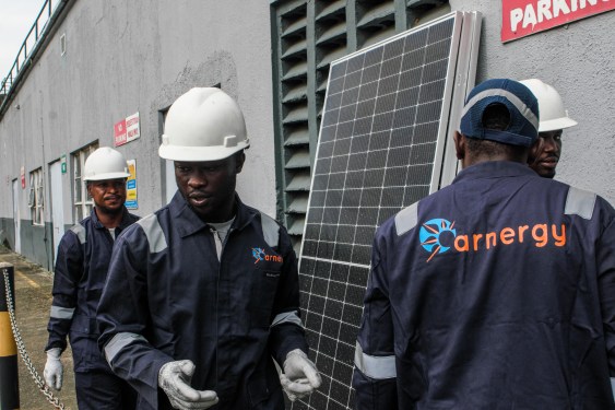 Arnergy crew with solar panels