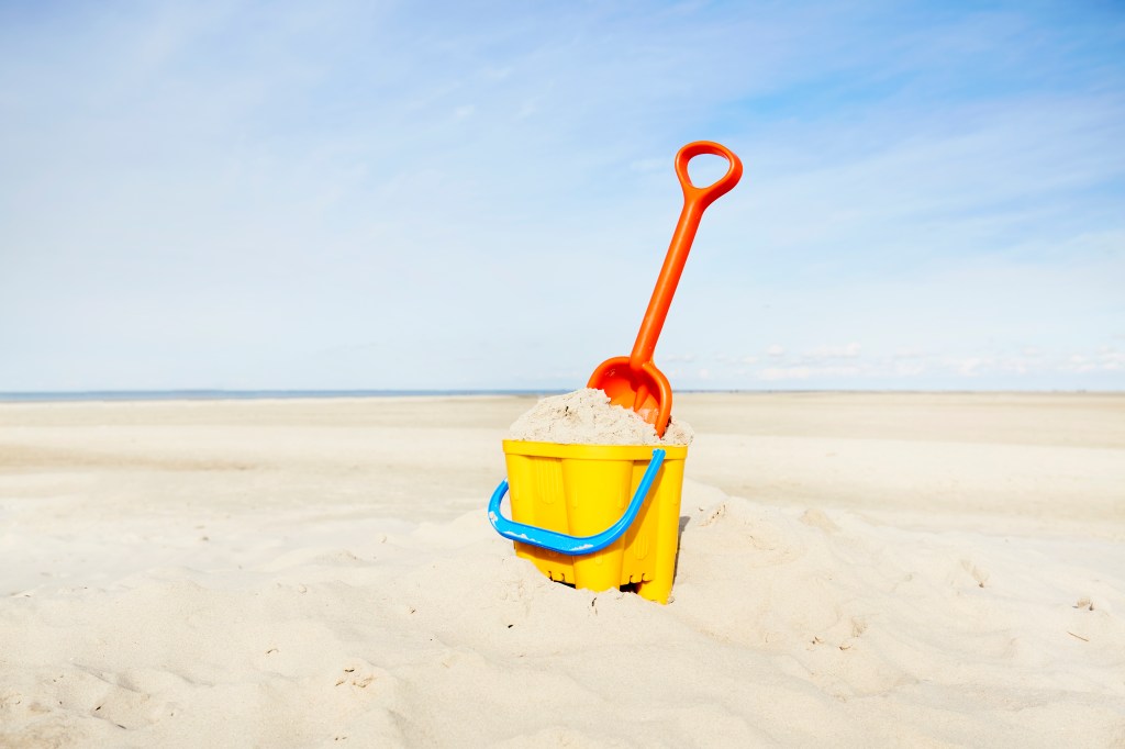 Sand pail and shovel on beach
